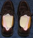 Shoes w/insoles removed & longitudinal metatarsal arch pads inserted